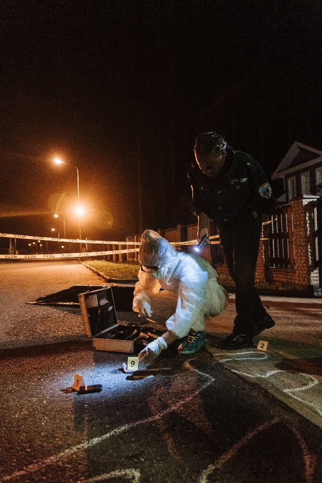 a police officer and investigator on crime scene